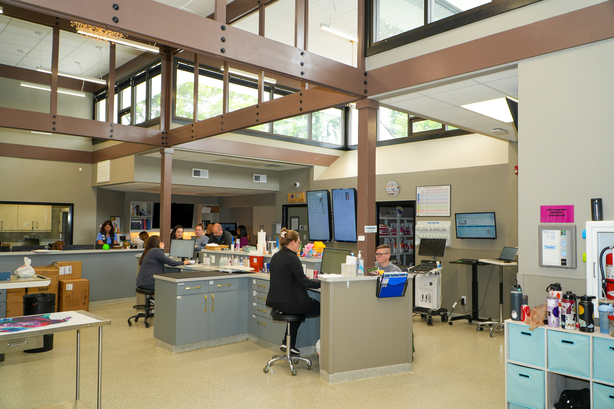 People work in an open concept office area