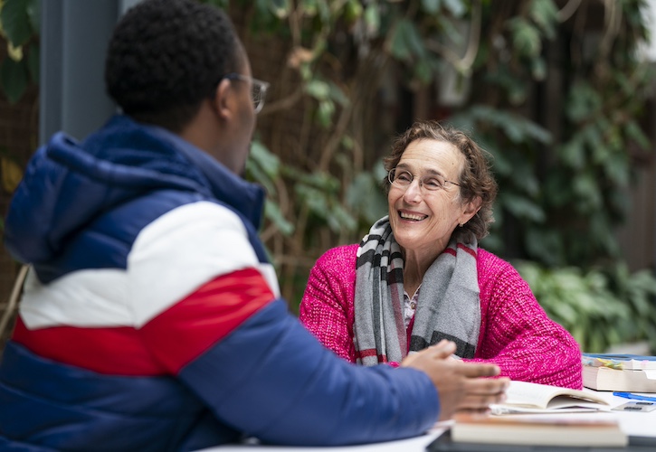 Student and Faculty Member talking
