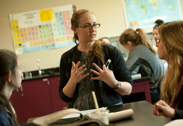 A woman teaching in a classroom