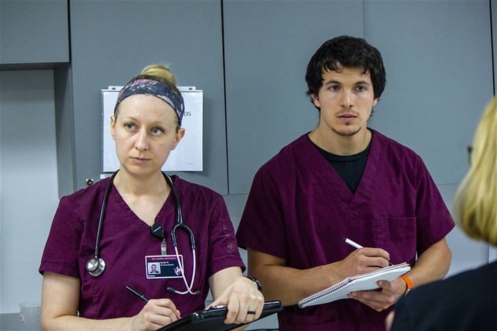 Bellarmine University Nursing students take notes during instruction.