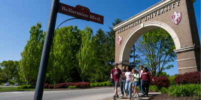 students walk through the bellarmine archway