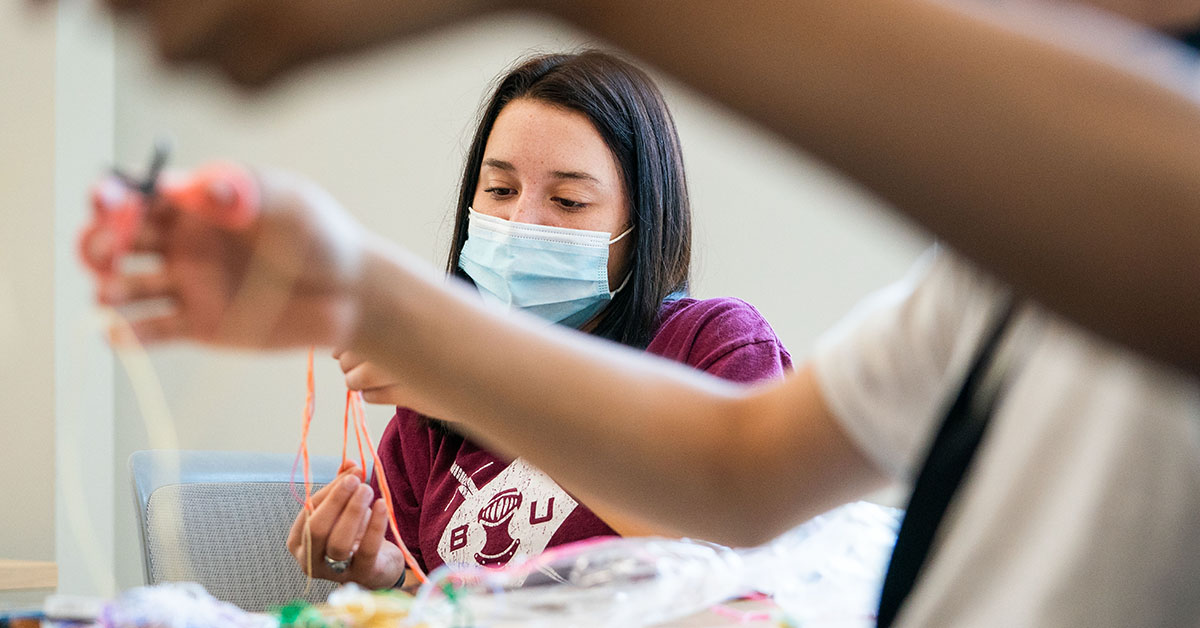 a student with a mask