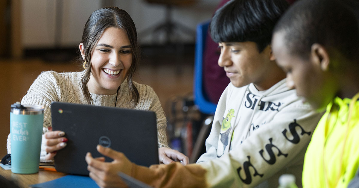 a teacher and two students