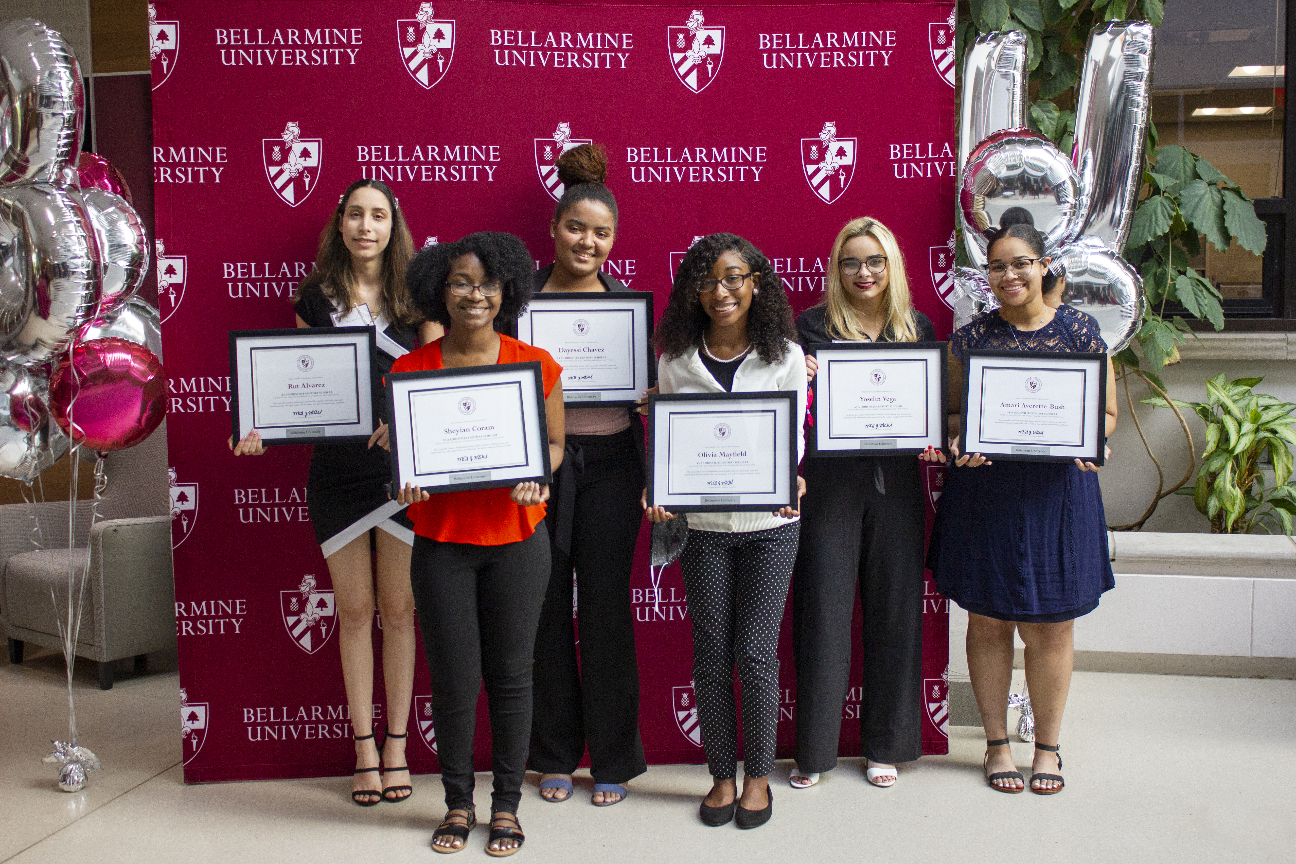Six Students Holding Certificates