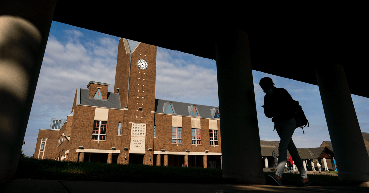 A student walking in the quad