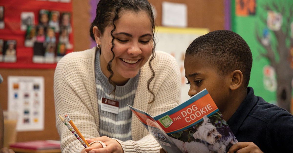Bellarmine student teacher with an elementary student