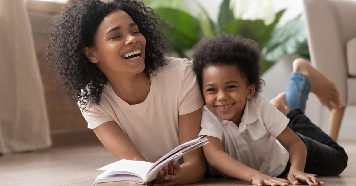 a mother and her young son reading a book