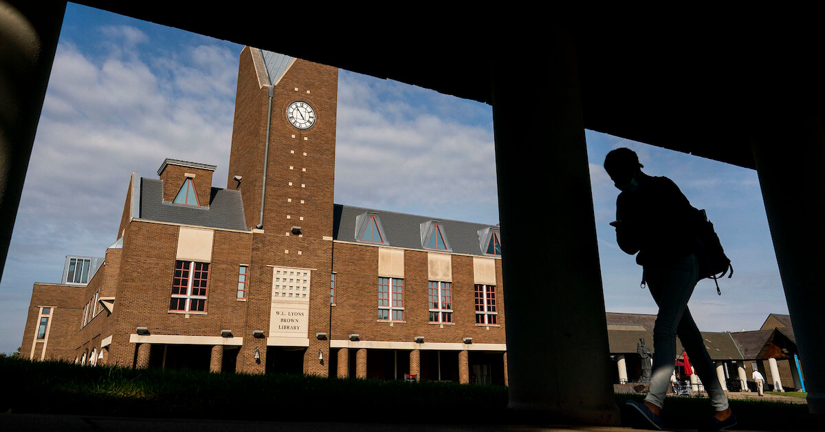 Student walking in the quad