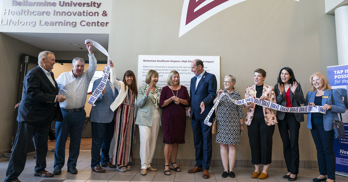a group of people at a ribbon cutting ceremony