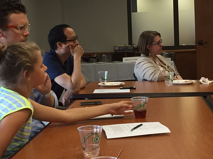 Klassen, Choi, and Prince listen to student presentations