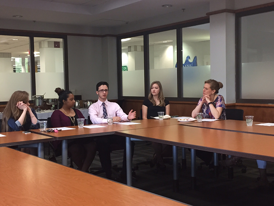 Faculty sit on a panel