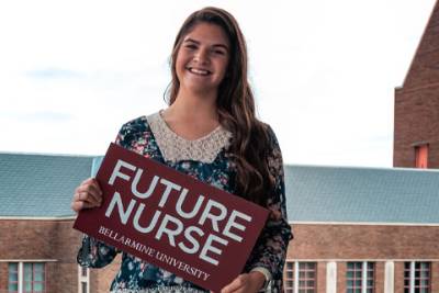 Nursing student holds a sign that says future nurse