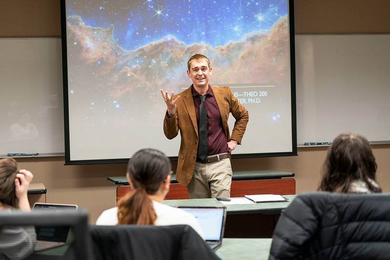 Bellarmine Theology professor Dr. Andrew Stone Porter speaks in front of a class.