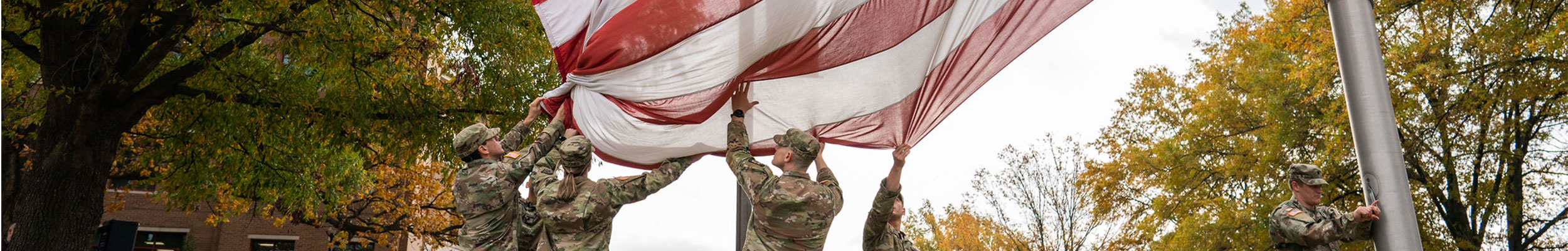 a few students at Bellarmine and a flag