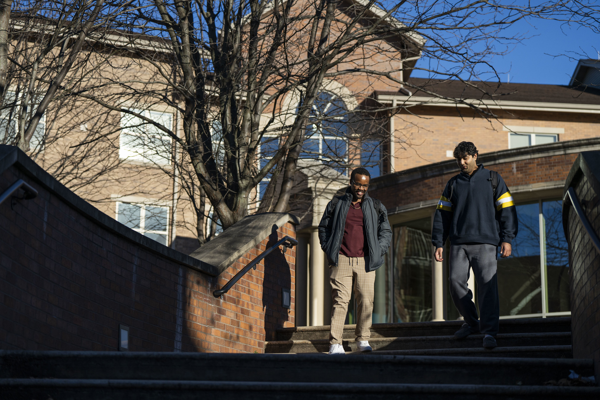 Two students outside res halls