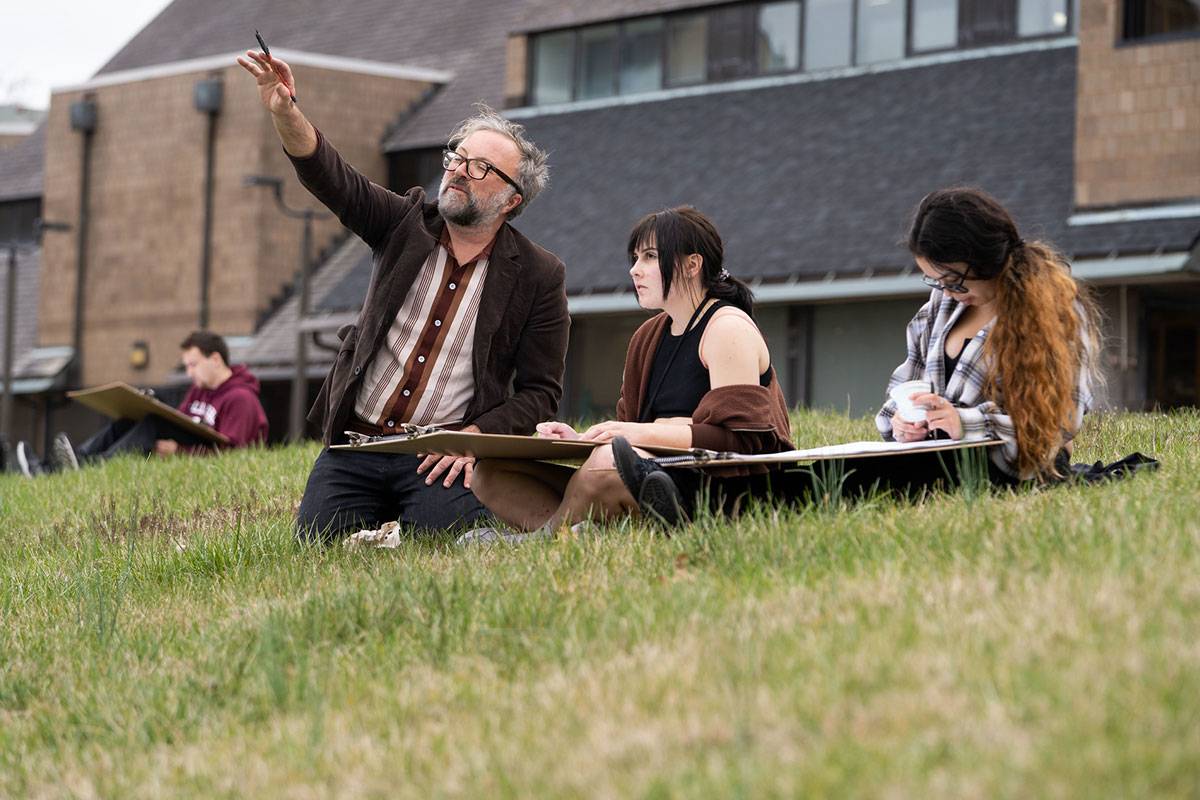 Students receiving instruction from a professor.