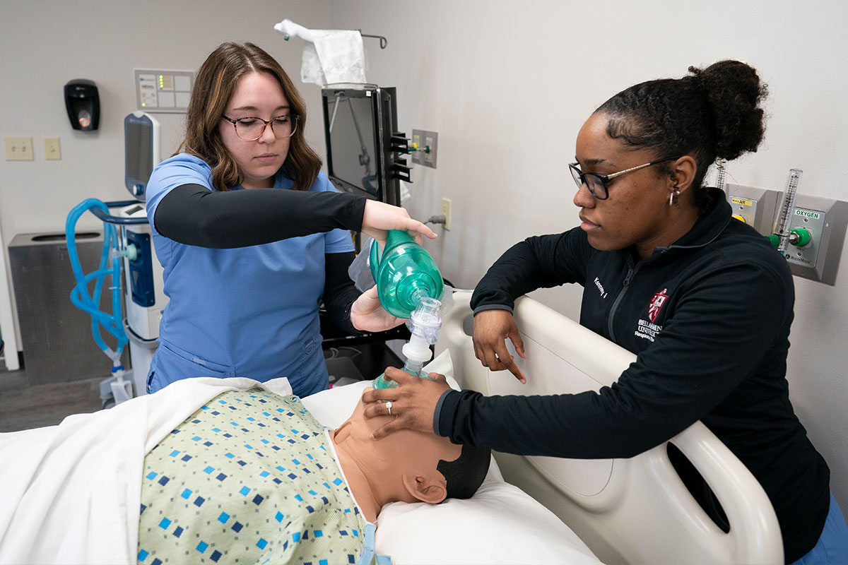 Respiratory therapy students practice clinical procedures in a lab