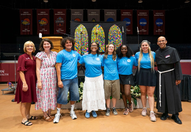 Roxanna Trivitt, program coordinator; Jessica Able, assistant director; Spiritual Peer Mentors Luis Alvarez, Baije Bell, Amra Skenderovic, Liv Nyirarukundo, and Katarina List; Fr. John Pozhathuparambil, director of Campus Ministry.