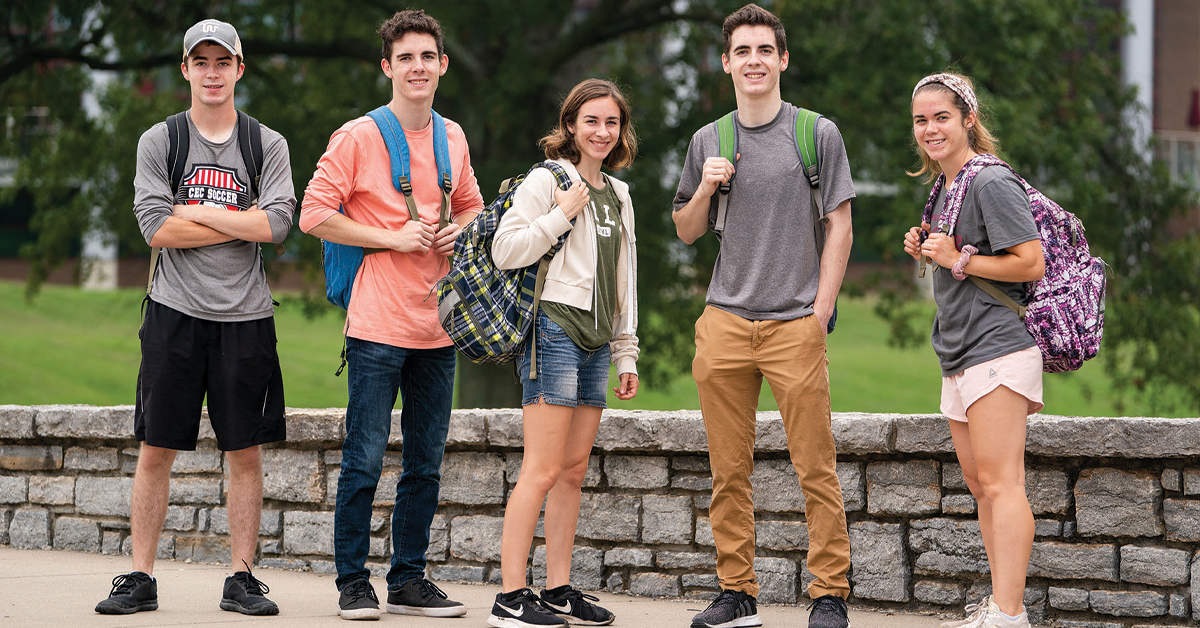 A group of students standing on campus