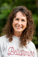 Amy Harrison smiling in a gray Bellarmine sweatshirt