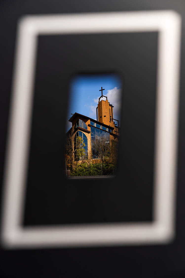 Our Lady of the Woods Chapel as seen through gates on Owsley Brown Frazier Stadium