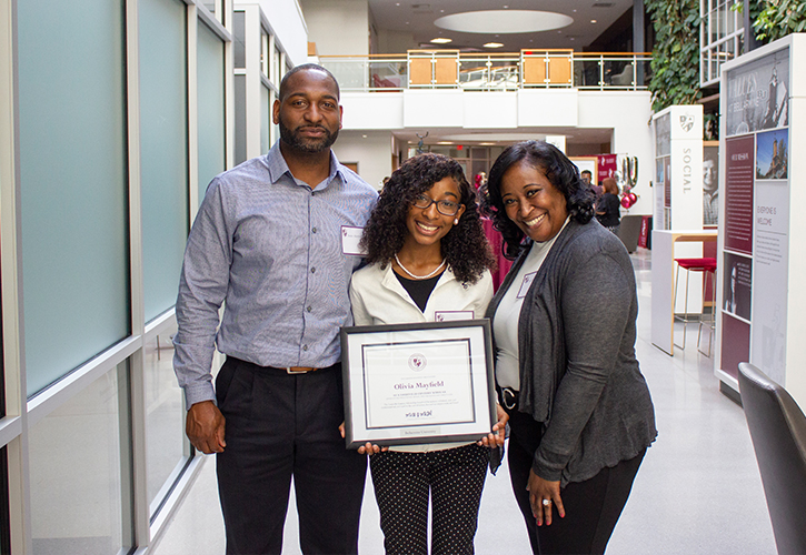 Century Scholars recipient accepts award with her parents