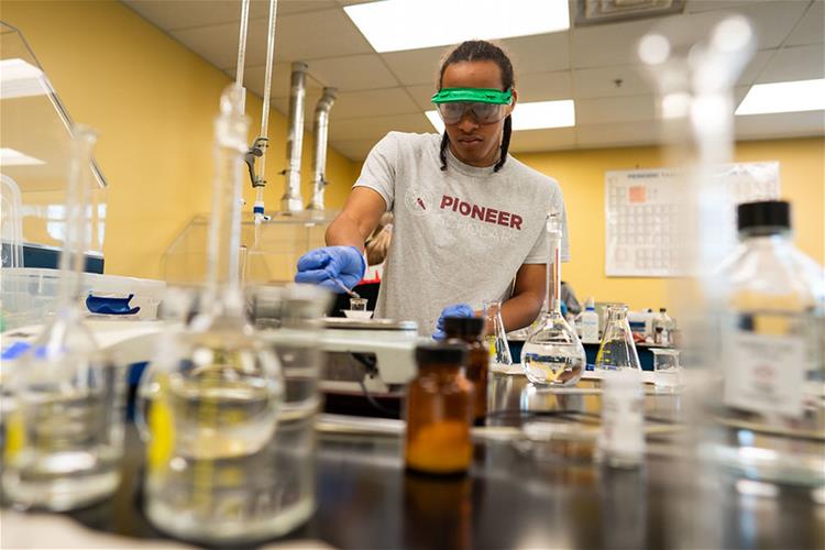 A Bellarmine University student conducting an experiment in the chemistry lab.