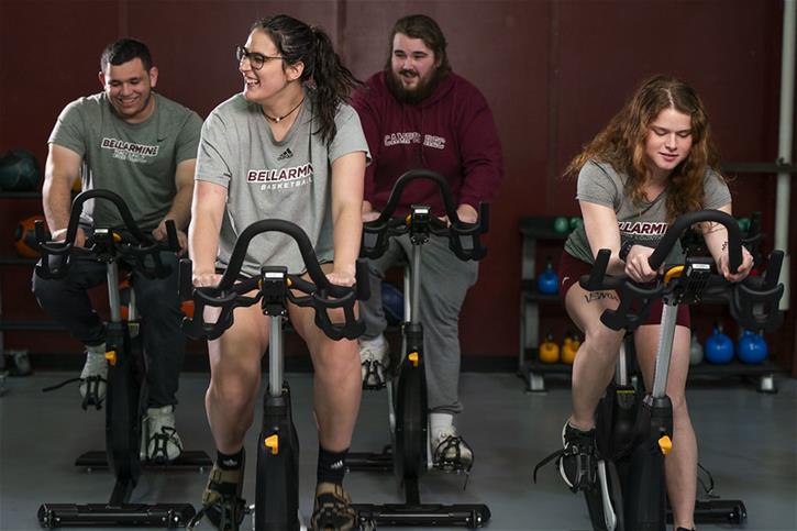 Students use stationary exercise bikes in the Sport, Recreation and Fitness Center (SuRF) at Bellarmine University.