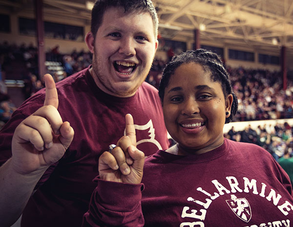 Students cheering at basketball game