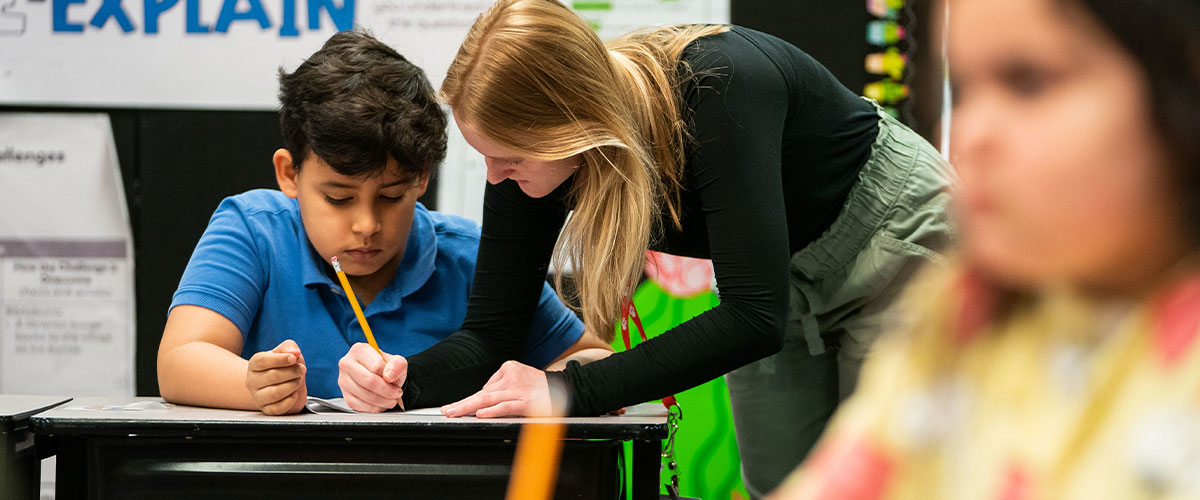 Teacher teaching student