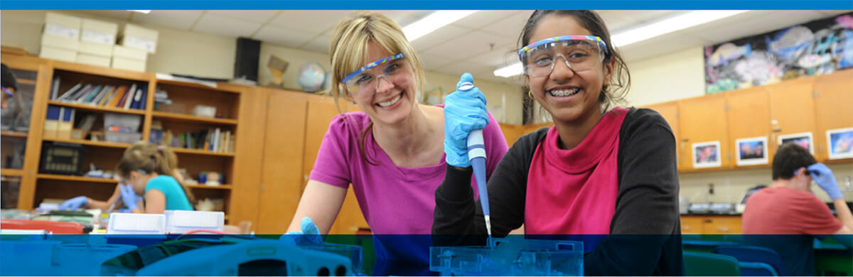 Teacher and student working in a lab