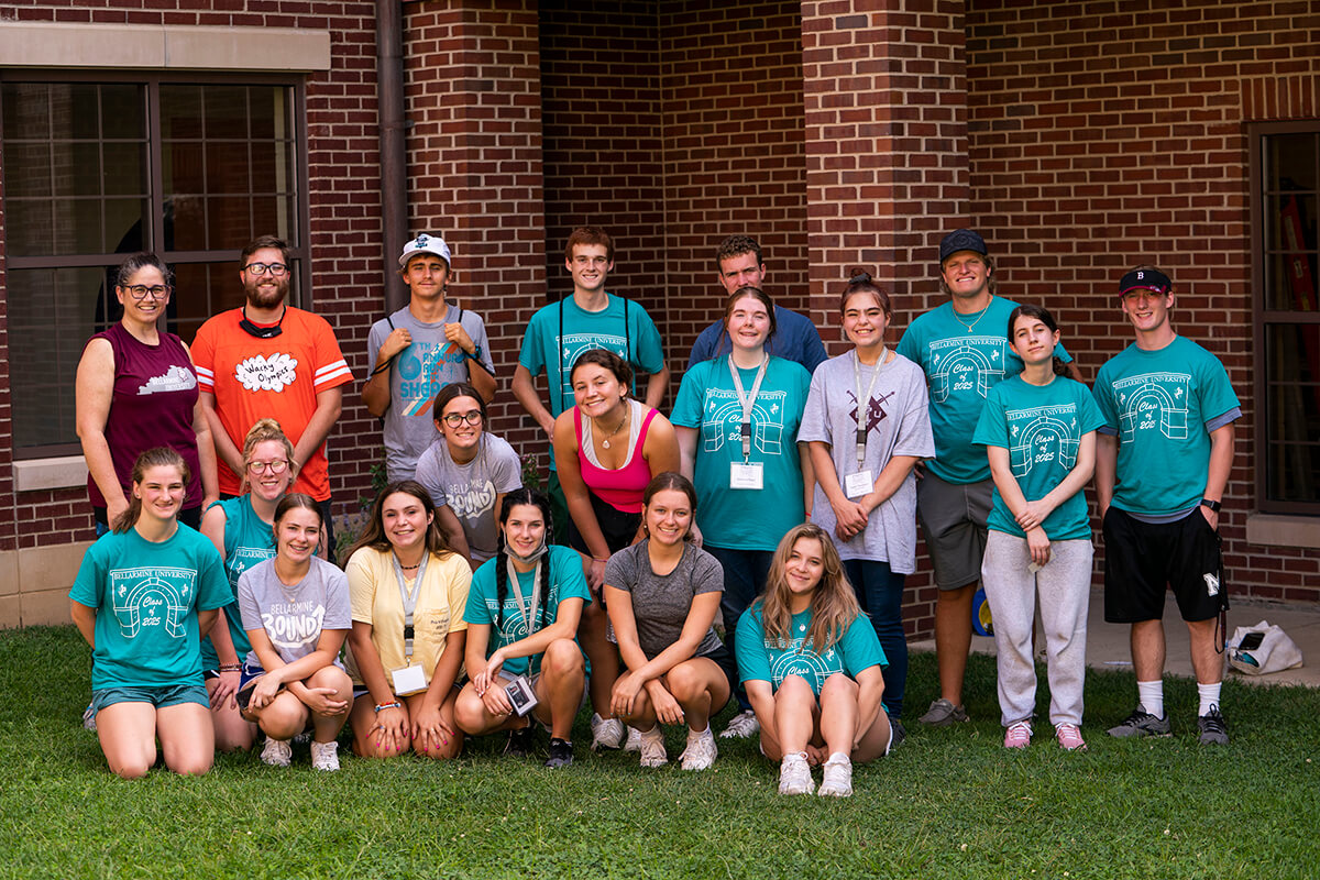 Group of student volunteers smile before starting a day of giving back to the community