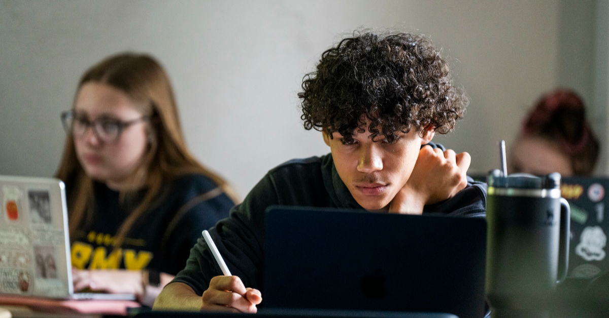 A Bridge to BU student concentrates during a Summer Bridge class.