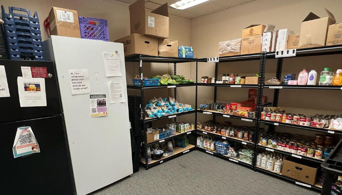 shelves of food and two large refrigerators